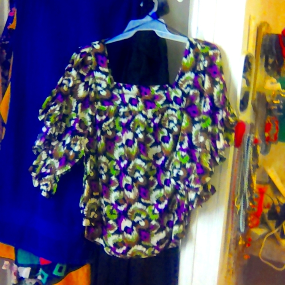 Women's blouse very light weight material. Very bright colors see photo